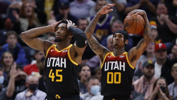 Utah Jazz guard Donovan Mitchell (45) and guard Jordan Clarkson (00) react after a call in the fourth quarter against the Sacramento Kings at Vivint Arena.